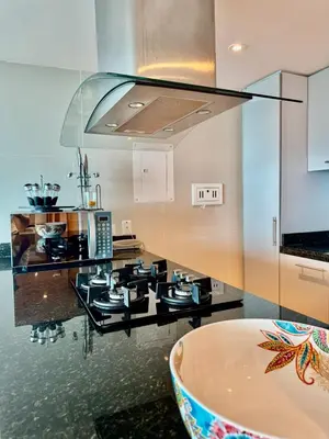 a kitchen with a counter with a stove top oven at Beautiful 2 BR Ocean View Condo in Cartagena in Cartagena de Indias