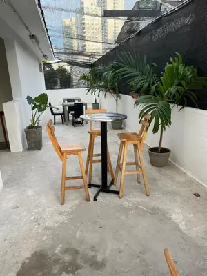 a table and two chairs and a table and some plants at Habitación cerca de la playa 201 in Cartagena de Indias