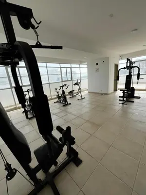 a gym with cardio equipment in a large room at Alessandro estilo italiano in Cartagena de Indias