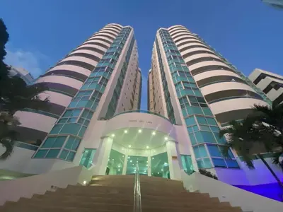 two tall buildings with stairs in front of a building at Tropical Paradise - vista al mar, el Laguito Cartagena in Cartagena de Indias