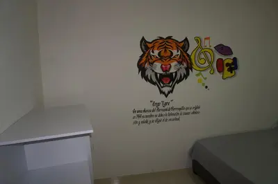 a sticker of a tiger on a wall at Hostal Barrio Abajo in Barranquilla