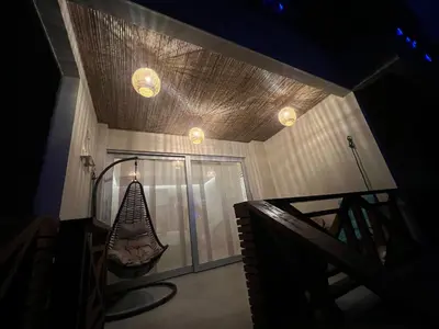 a room with a hammock hanging from the ceiling at Eco Hotel Laguna Beach - Bloque 8 Suite 101 in San Silvestre