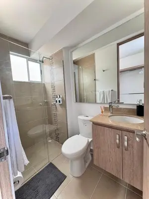 a bathroom with a toilet and a sink and a shower at Apartamento en el Norte de Barranquilla in Barranquilla