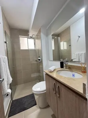 a bathroom with a sink and a toilet and a shower at Apartamento en el Norte de Barranquilla in Barranquilla