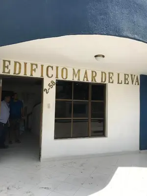 a white building with a sign that readsipedia marqueziane at Apartamento en Bello Horizonte, Santa Marta in Santa Marta