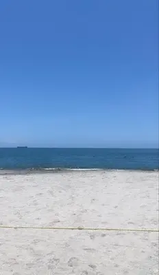 an empty beach with the ocean in the background at Apartamento en Bello Horizonte, Santa Marta in Santa Marta