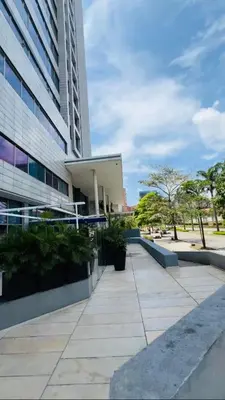 a building with a sidewalk next to a building at Apartment Hilton Garden Inn Building in Barranquilla