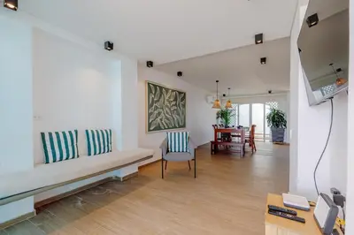 a living room with a couch and a table at Lux Beach House, Aldaba Selection in Cartagena de Indias