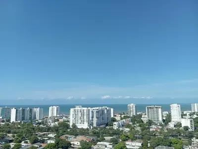 a city skyline with tall buildings and the ocean at Amaneceres de ensueño en Cartagena in Cartagena de Indias