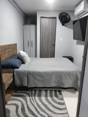 a bedroom with a bed and a flat screen tv at Amaneceres de ensueño en Cartagena in Cartagena de Indias