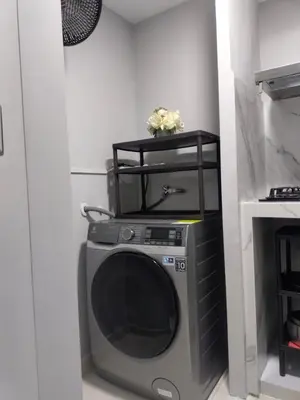 a washing machine in a corner of a room at Amaneceres de ensueño en Cartagena in Cartagena de Indias