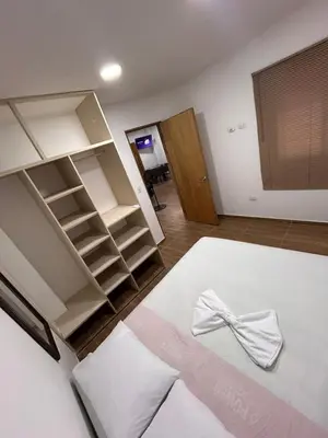 a room with a bed with a bow on it at Apartamento Villa Mary C-202 in Coveñas