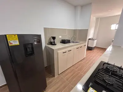 a kitchen with a stainless steel refrigerator and a stove at Apartamento Villa Mary C-202 in Coveñas