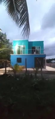 a blue house with lights on top of it at Casa de playa moñitos in Moñitos