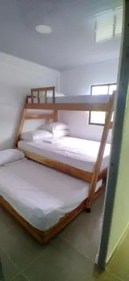 a couple of bunk beds in a room at Casa de playa moñitos in Moñitos