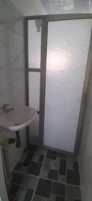 a bathroom with a shower and a sink at Casa de playa moñitos in Moñitos