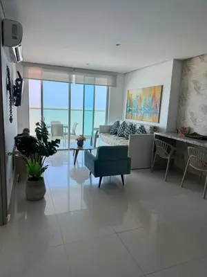 a living room with a couch and a table at Palmeto Beach 04 - 1 alcoba in Cartagena de Indias