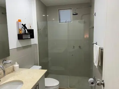 a bathroom with a shower with a toilet and a sink at Espectacular apto frente al Mar! in Cartagena de Indias
