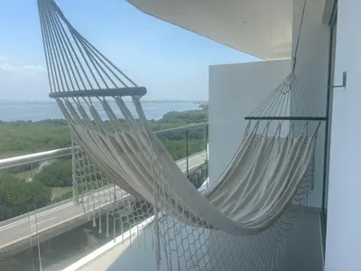 a hammock hanging from the balcony of a house at Espectacular apto frente al Mar! in Cartagena de Indias