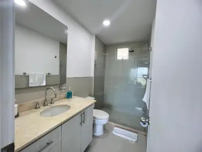 a bathroom with a sink and a toilet and a shower at Espectacular apto frente al Mar! in Cartagena de Indias