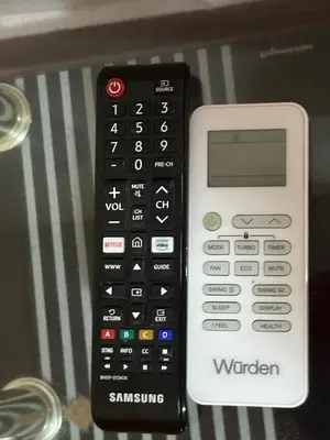a remote control sitting on top of a table at Apartamento #1 in Puerto Colombia