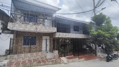 a brick building with bars on the front of it at Apartamento #1 in Puerto Colombia