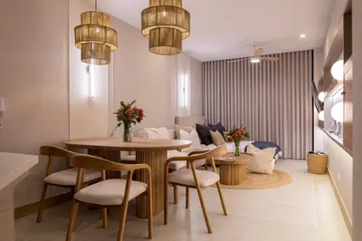 a living room with a table and chairs and a couch at Loft con salida al mar en Cartagena in Cartagena de Indias