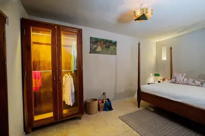 a bedroom with a bed and a glass door at Lujosa Casa 5Hab Jacuzzi & Piscina in Cartagena de Indias
