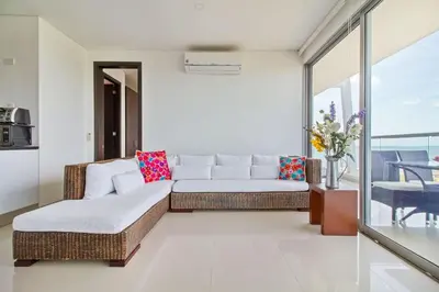 a living room with a couch and a table at Beach 2-bedroom apartment in Cartagena de Indias