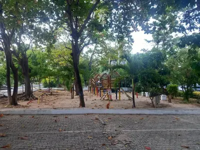 a playground in a park with trees at Playa Los alcatraces in Santa Marta