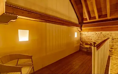 a hallway with a table and a chair in a room at Colonial House with Pool in Cartagena de Indias