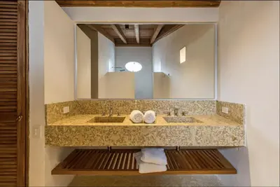 a bathroom with two sinks and a large mirror at Colonial House with Pool in Cartagena de Indias