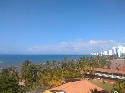 an aerial view of the ocean and palm trees at Edificio Mares de Coveñas apto frente al Mares de coveñas in Coveñas