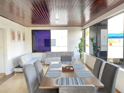 a dining room with a table and chairs at Acogedor Apartamento cerca al Mar in Cartagena de Indias