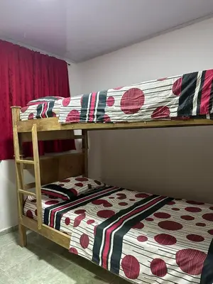 two bunk beds in a room with a bed at Apartamento #2 in Puerto Colombia