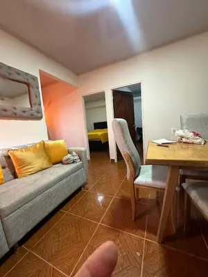 a living room with a couch and a table at Apartamento #3 in Puerto Colombia