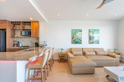 a kitchen and living room with a couch and a table at Cartagena Dreams in Cartagena de Indias