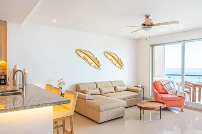a living room with a couch and a table at Cartagena Dreams in Cartagena de Indias