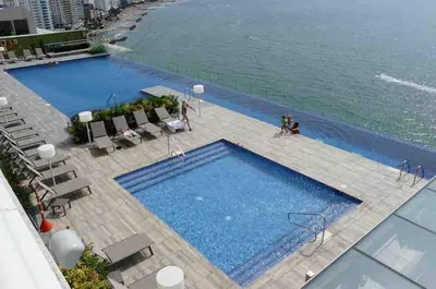 an overhead view of a large swimming pool next to the water at Luxury apt sea front AC Wifi pool at cartagena in Cartagena de Indias