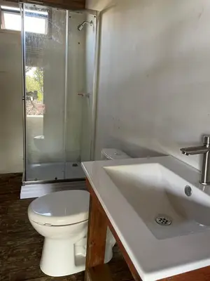 a bathroom with a toilet and a sink and a shower at Prueba1 in Tintipan Island