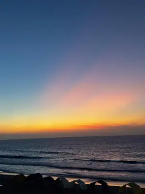 a sunset over the ocean at the beach at casa kite school in Cartagena de Indias