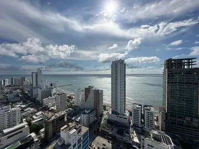 a view of a city with the ocean and buildings at Apartamento Magnoloft Bocagrande in Cartagena de Indias