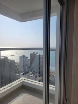 a view of the ocean from a room with a window at Apartamento Magnoloft Bocagrande in Cartagena de Indias