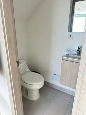 a bathroom with a toilet and a sink at Apartamento Magnoloft Bocagrande in Cartagena de Indias