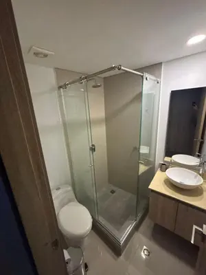 a bathroom with a shower and a toilet and a sink at Amazing Bay View Apartment in Cartagena! in Cartagena de Indias