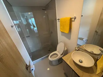 a bathroom with a shower and a toilet and a sink at Amazing Bay View Apartment in Cartagena! in Cartagena de Indias