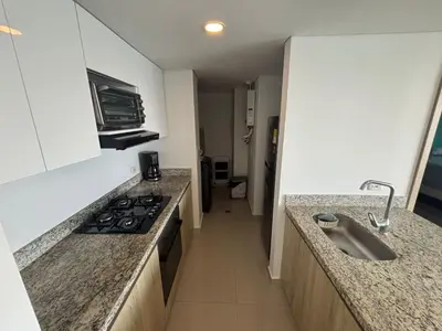 a kitchen with a sink and a stove top oven at Amazing Bay View Apartment in Cartagena! in Cartagena de Indias