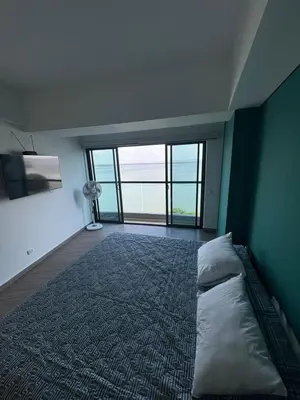 a bedroom with a large bed with a large window at Amazing Bay View Apartment in Cartagena! in Cartagena de Indias
