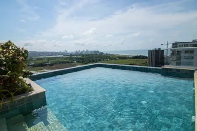 a large swimming pool on top of a building at New & Comfortable Apartment In Cielo Mar in Cartagena de Indias
