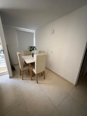 a dining room with a table and chairs at Apartamento norte de Barranquilla in Barranquilla